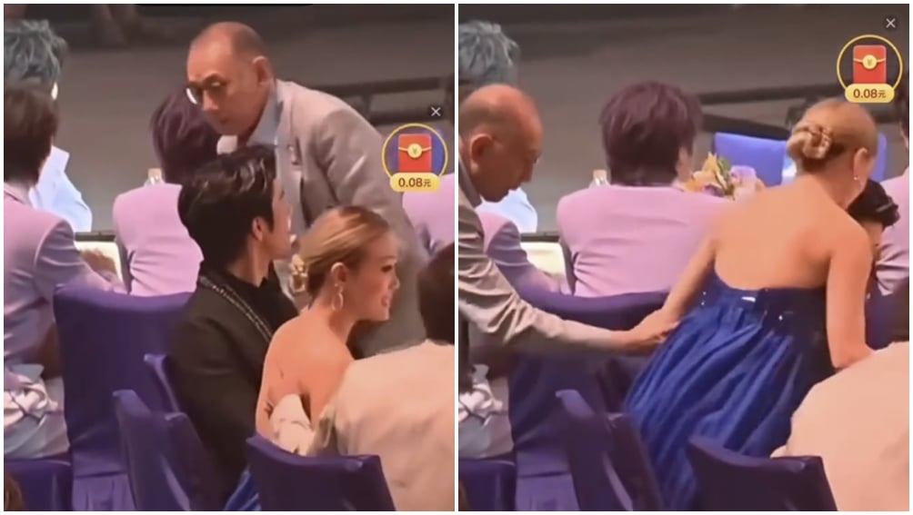 楊受成將容祖兒帶離座位。（圖片來源：微博）